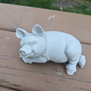 Small concrete pig figure